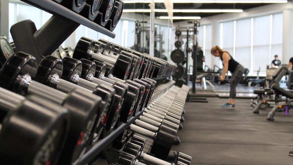 a woman in gym swarm