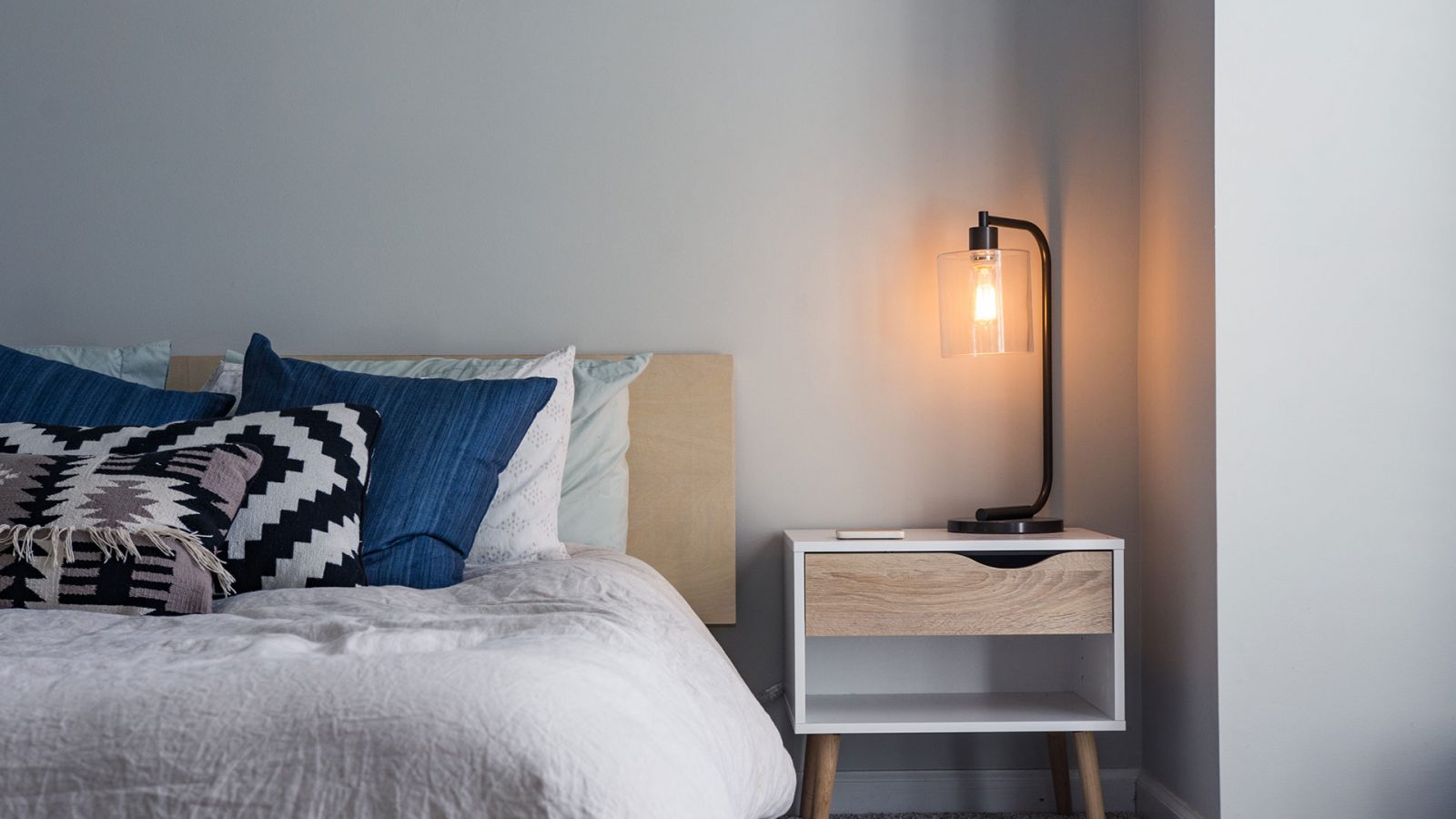 bed with side table and lamp swarm