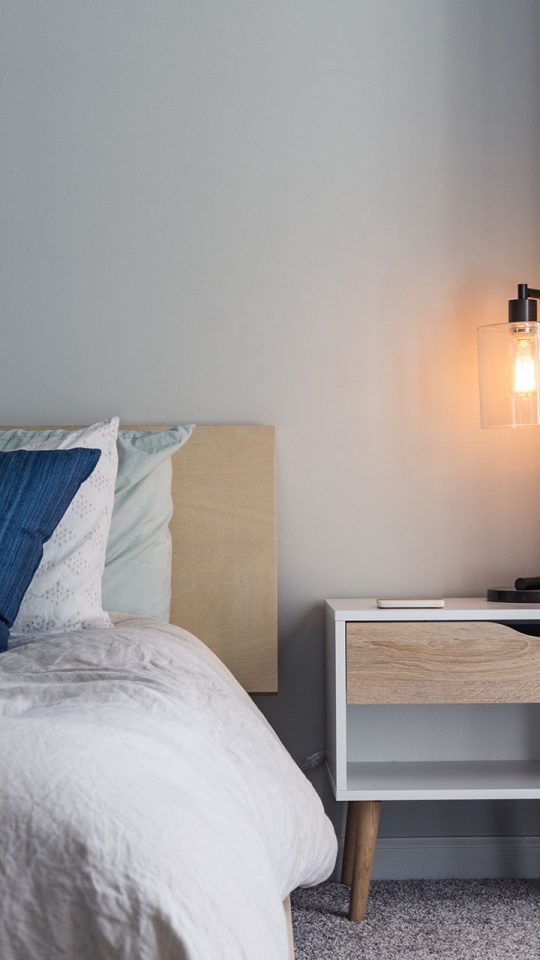bed with side table and lamp swarm