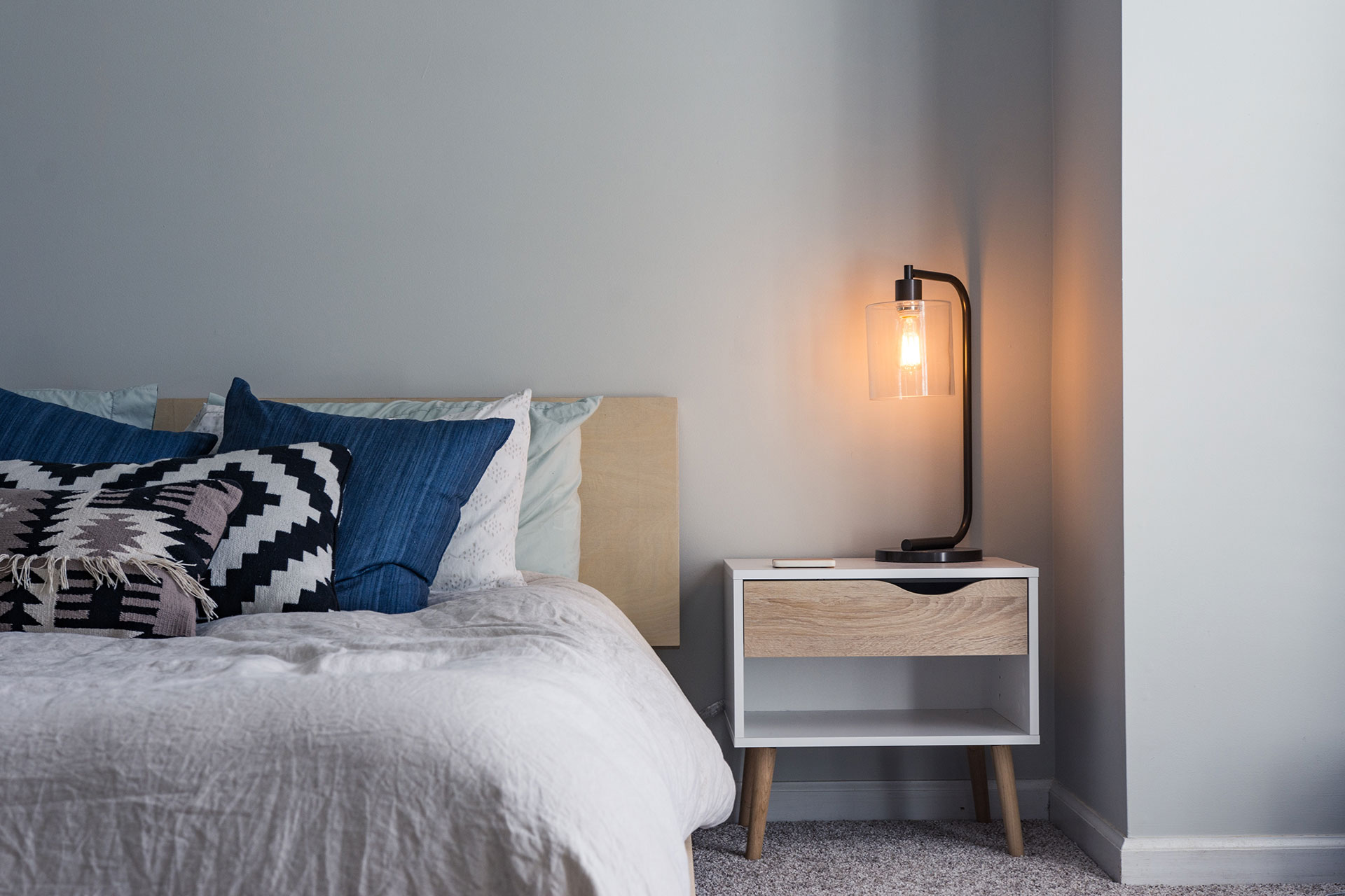 bed with side table and lamp swarm
