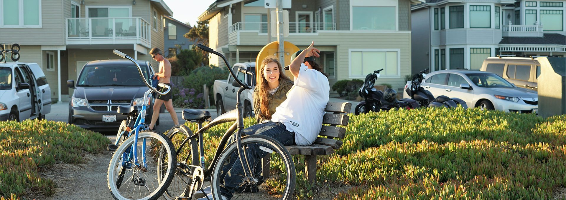 couple sitting on park bench swarm